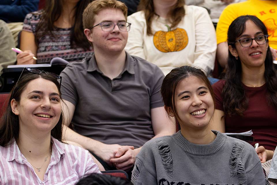 Students in a classroom smiling