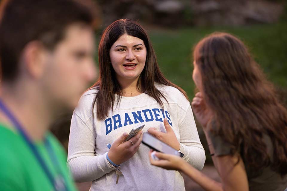 Two students sitting at a table laughing
