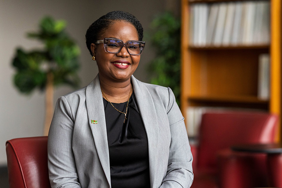 Giselle Gabriel smiling. She is wearing a small pin depicting the Flag of Dominica.