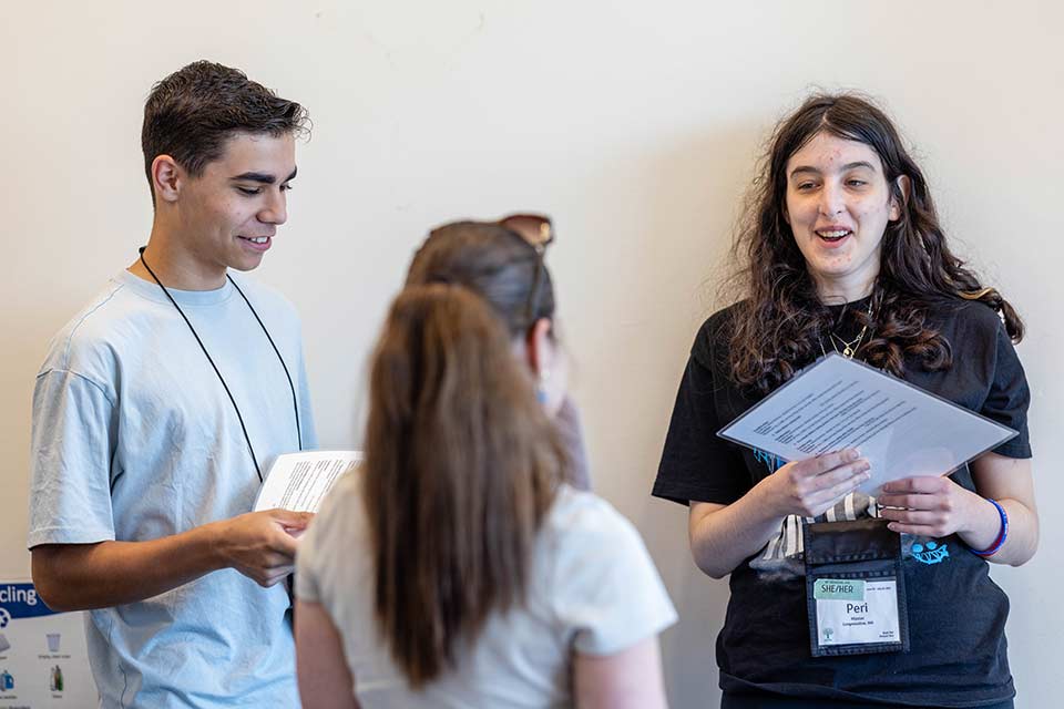 Three Genesis students talking