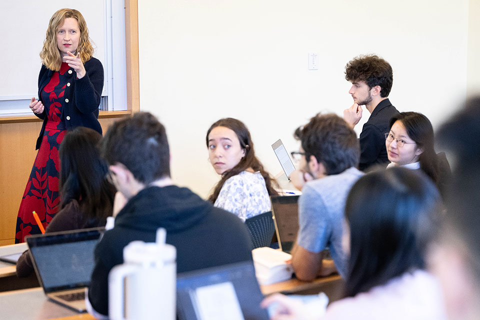 A professor speaks to a classroom of students