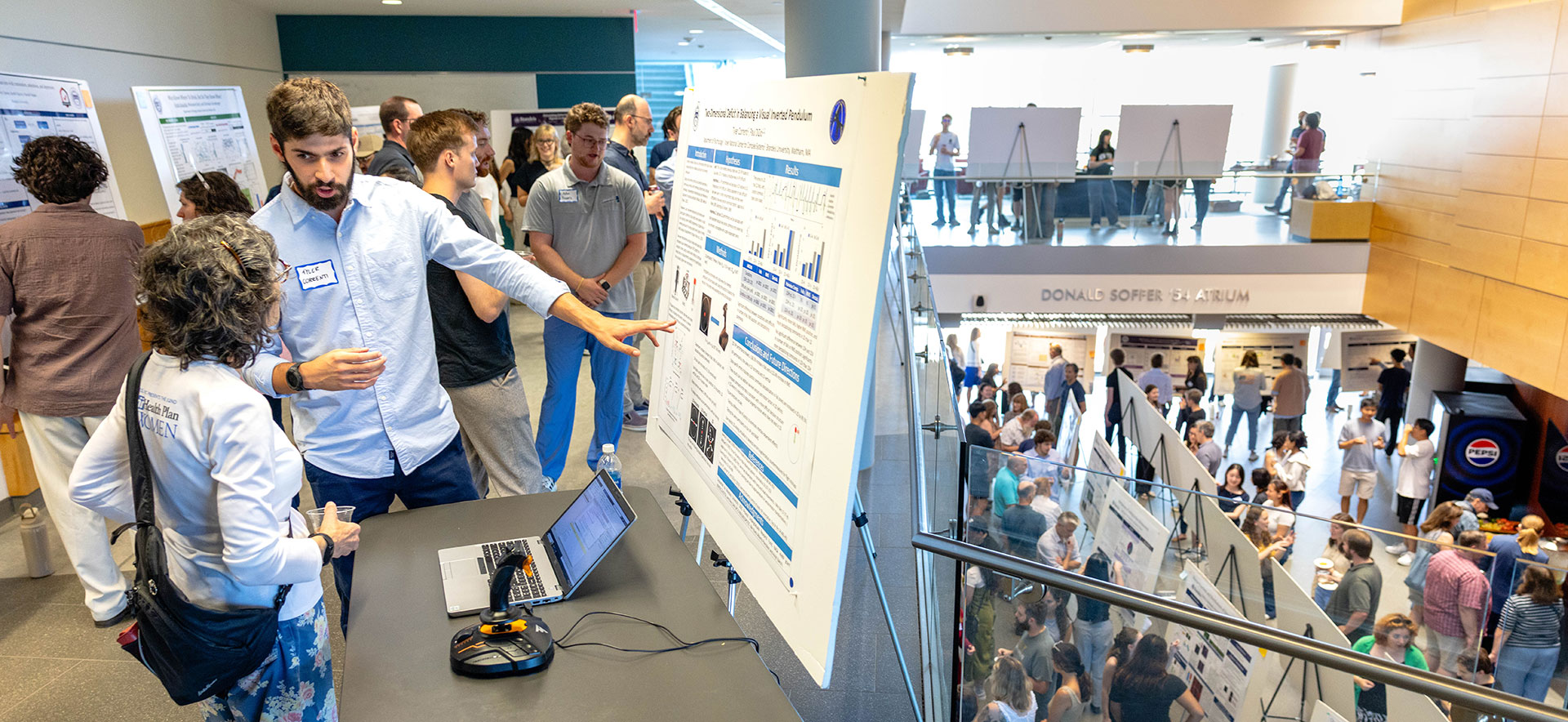 The Shapiro Science Center filled with student presenting their research posters.
