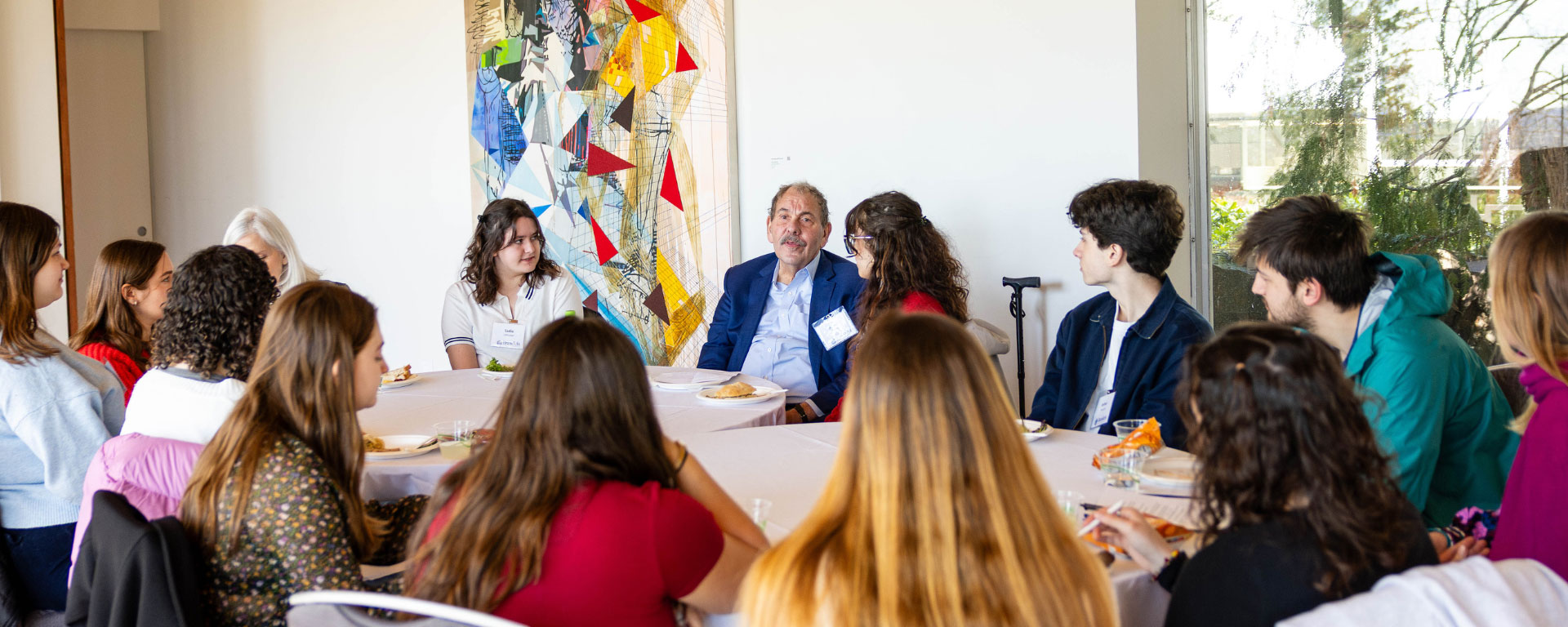 President Levine enjoys a conversation with students.